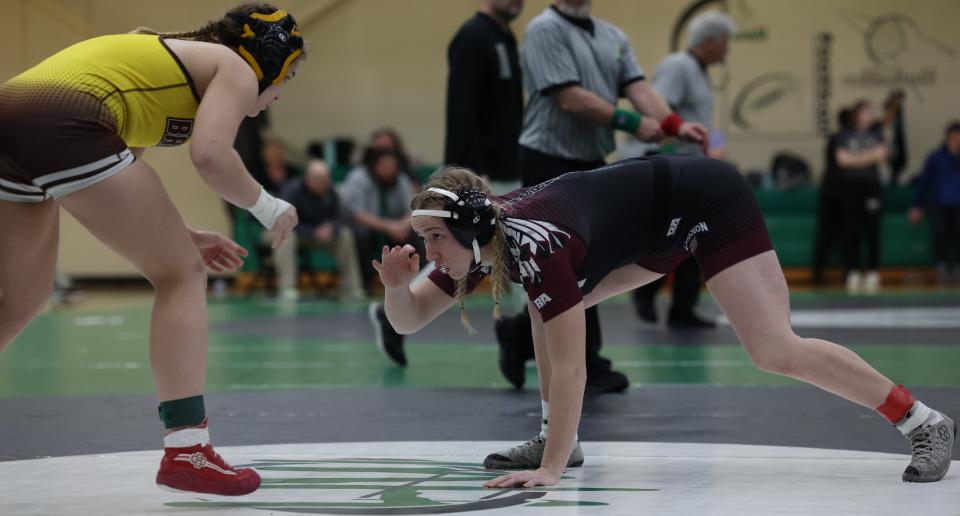 Sophia Rohrs, right, of Lebanon wrestles against Abigail Miller of Western Brown in the finals of the 140-pound class. Rohrs won by pin in the second period of the OHSAA regional girls wrestling tournament at Harrison High School March 5, 2023. The top four girls in each weight class advance to the state tournament in Columbus, Ohio.