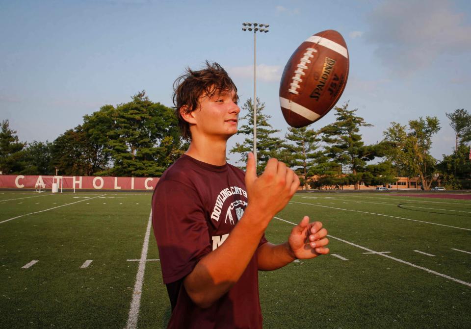 West Des Moines Dowling Catholic junior quarterback Jaxon Smolik poses for a photo at Dowling Catholic High School after practice on Wednesday, Aug. 18, 2021.