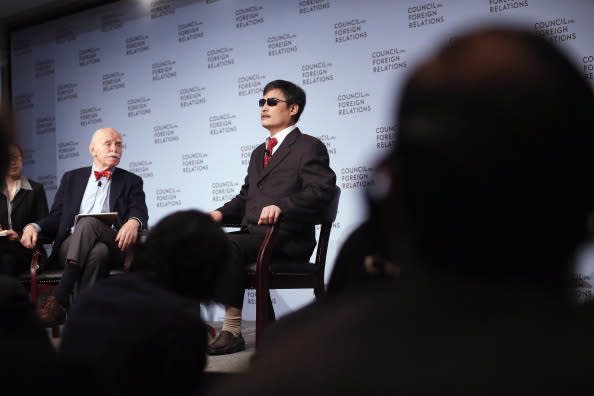 Chinese activist Chen Guancheng (R) speaks as Jerome Cohen (L), adjunct senior fellow for Asia studies at the Council on Foreign Relations, looks on at the Council on Foreign Relations on May 31, 2012 in New York City. This was Chen's first major public engagement since he escaped confinement and left China nearly two weeks ago. (Photo by Mario Tama/Getty Images)