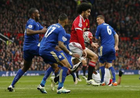 Britain Football Soccer - Manchester United v Leicester City - Barclays Premier League - Old Trafford - 1/5/16 Leicester City's Danny Simpson and Wes Morgan in action with Manchester United's Marouane Fellaini Action Images via Reuters / Jason Cairnduff/ Livepic