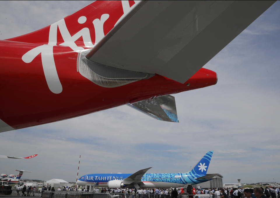 A Boeing 787-9 Dreamliner of Air Tahiti Nui rolls out for a demonstration flight at Paris Air Show, in Le Bourget, east of Paris, France, Tuesday, June 18, 2019. The world's aviation elite are gathering at the Paris Air Show with safety concerns on many minds after two crashes of the popular Boeing 737 Max. (AP Photo/Michel Euler)