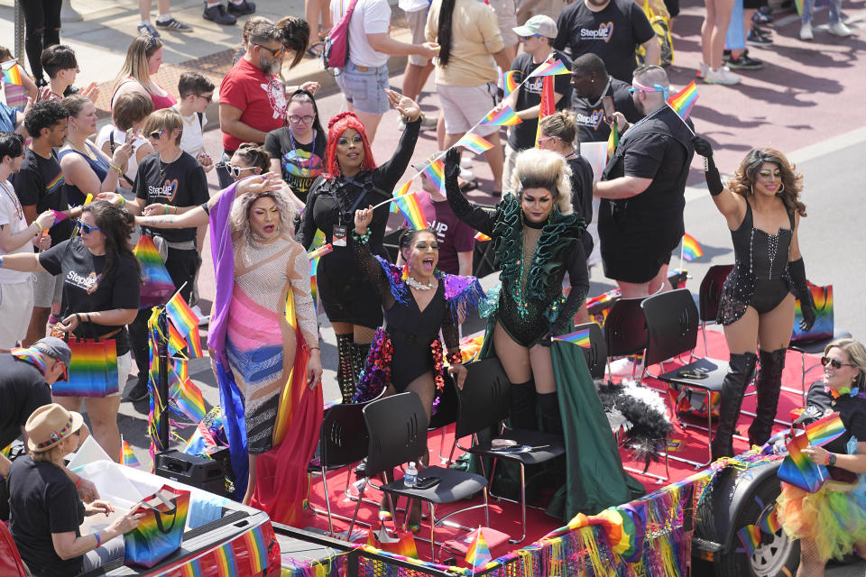 A crowd gathers along Delaware Street to watch the Pride Parade, Saturday, June 10, 2023, in Indianapolis. (AP Photo/Darron Cummings)