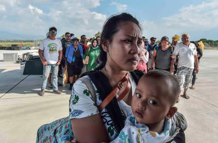 People injured or affected by the earthquake and tsunami wait to be evacuated on an air force plane in Palu, Central Sulawesi, Indonesia, September 30, 2018. Antara Foto/Muhammad Adimaja via REUTERS