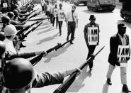 <p>Civil rights activists walk between a line of tanks and National Guard troops brandishing bayonets on Beale Street in Memphis, Tenn. (Photo: Bettmann/Getty Images) </p>