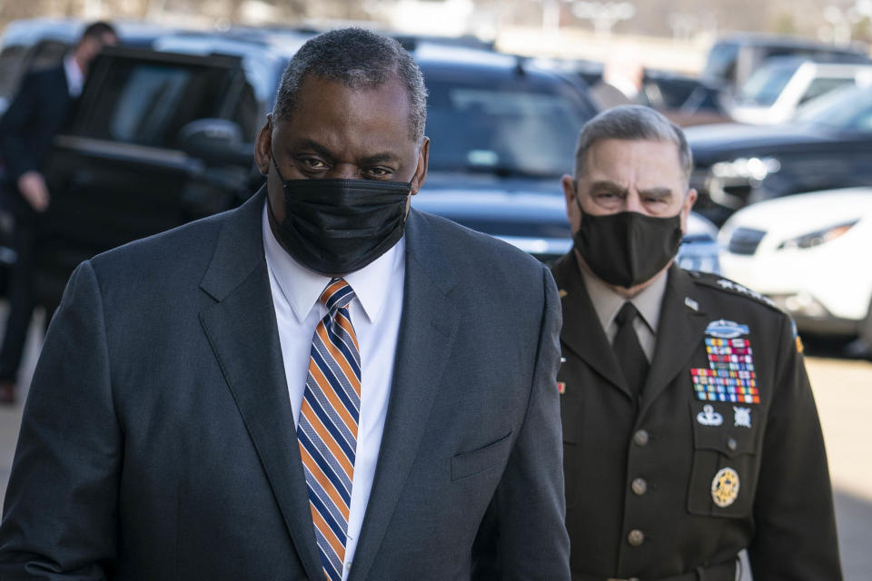 Gen. Mark Milley, chairman of the Joint Chiefs of Staff, escorts incoming Defense Secretary Lloyd Austin III to the Pentagon on Austin's first day in his new role on Jan. 22, 2021, in Arlington, Va. 