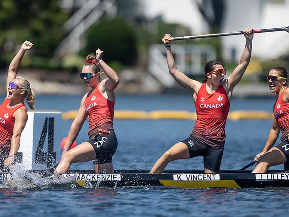 From left to right, Sophia Jensen, Sloan MacKenzie, Katie Vincent, and Julia Osende of Canada react after winning gold in the C4 women's 500 metres on Sunday at the ICF canoe sprint and paracanoe world championships in Dartmouth, N.S. (Darren Calabrese/Canadian Press - image credit)