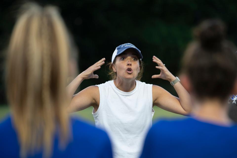 Dover-Sherborn head coach Erin Massimi makes a point during halftime of the Division 4 state championship game against Manchester-Essex at Babson College in Wellesley, June 21, 2022. The Raiders beat the Hornets, 10-7.