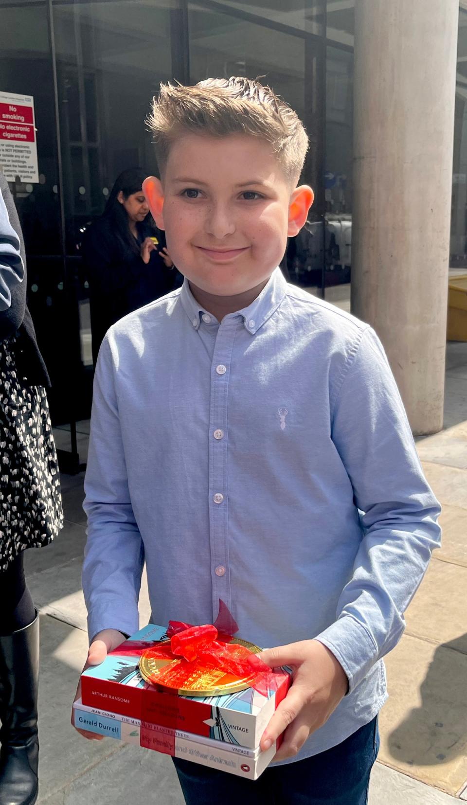 Ellis Edwards, 11, with his gifts from the royal pair (PA)