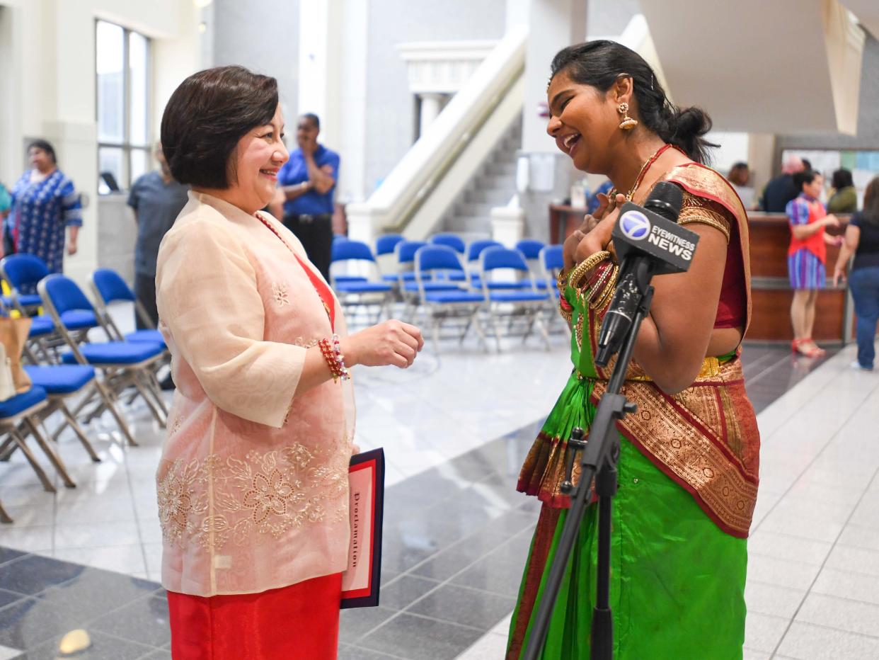 Dr. Sandra Dee and Dr. Nivedita Prasanna talk as Nivedita gets ready to interview with media during the AAPI Heritage Month celebration inside Jackson City Hall on Friday, May 3, 2024.