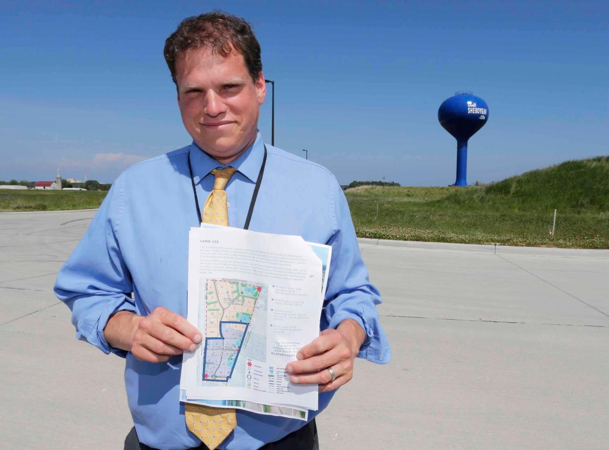 Sheboygan Director of Planning & Development Chad Pelishek holds a map of the ready to build SouthPointe Enterprise Campus, a business park in Sheboygan.