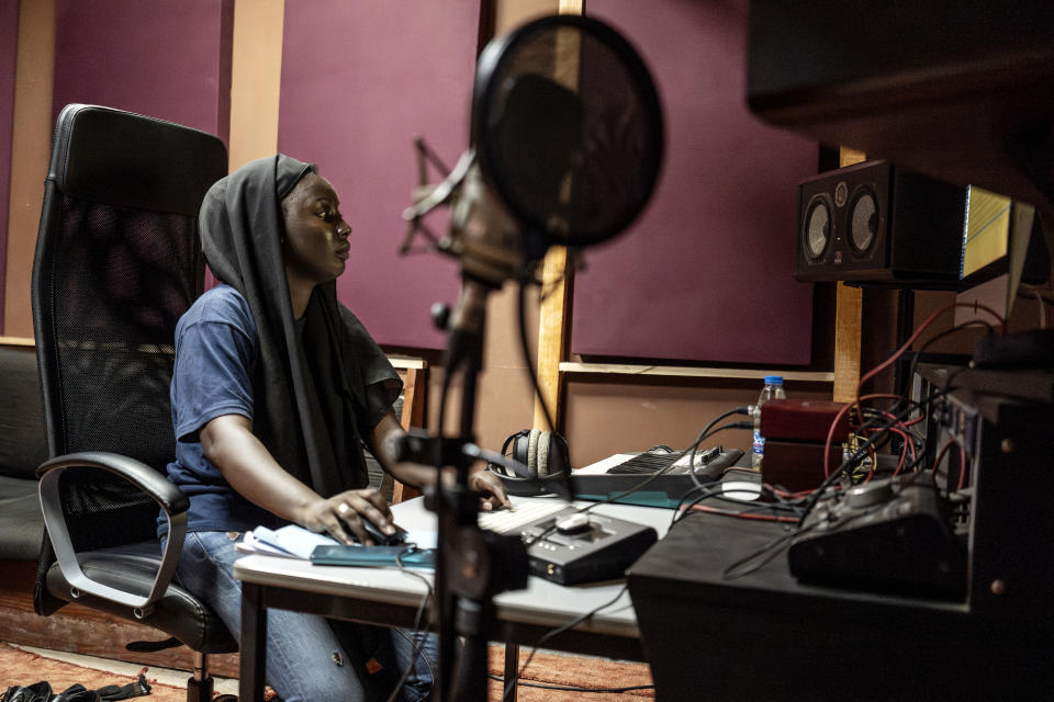 Aminata "Myamy TheAyGirl" Thiam, 31years - Old, creates a beat inside a studio in Dakar, Senegal, Wednesday, Aug. 14, 2024. Aminata Thiam is Senegal's first female beatmaker. (AP Photo/Annika Hammerschlag)