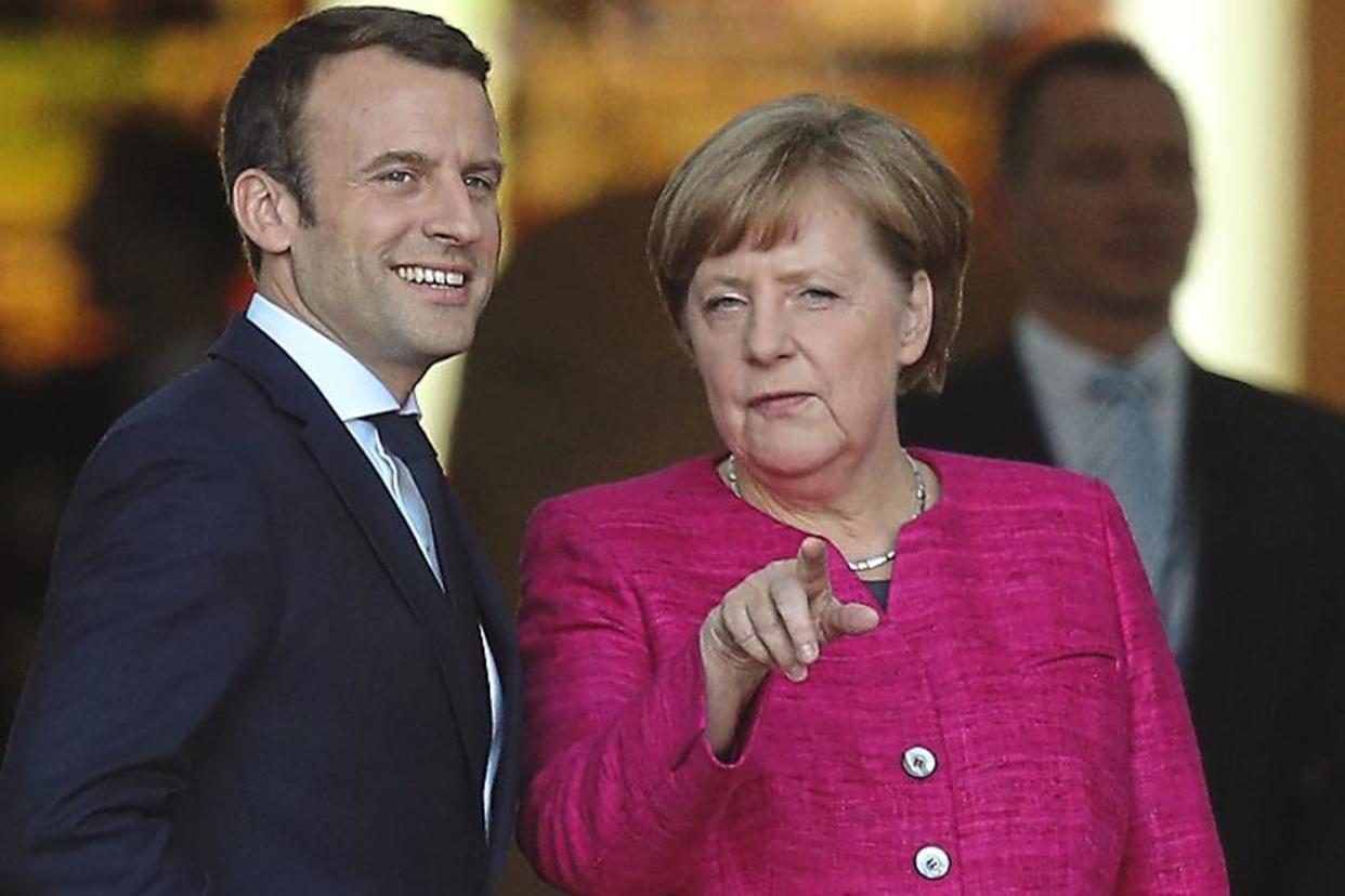 Brake: neither France's Emmanuel Macron nor Germany's Angela Merkel are inclined to speed up negotiations between the EU and Britain: Getty Images