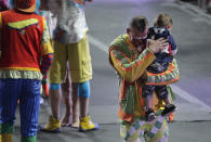 <p>Ringling Bros. boss clown Sandor Eke hugs his 2-year-old son Michael after the red unit’s final show, Sunday, May 7, 2017, in Providence, R.I. “The Greatest Show on Earth” is about to put on its last show on earth. (Photo: Julie Jacobson/AP) </p>