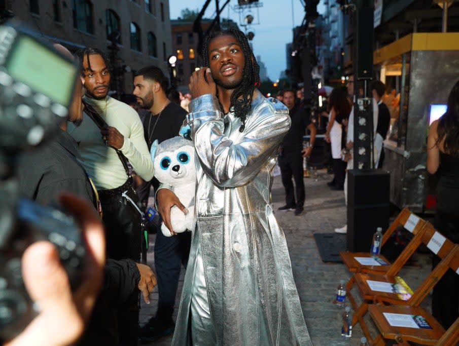 Lil Nas X holding a stuffed animal