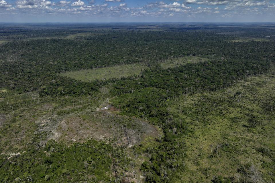 An area that has been illegally deforested by land-grabbers and cattle farmers is visible in an extractive reserve in Jaci-Parana, Rondonia state, Brazil, Tuesday, July 11, 2023. Some lawmakers and environmental groups are opposed to JBS being listed on the New York Stock Exchange, arguing that expanded capital would allow the company, responsible for much deforestation in the Amazon rainforest, to do even more harm. (AP Photo/Andre Penner)