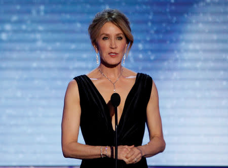 FILE PHOTO: 24th Screen Actors Guild Awards – Show – Los Angeles, California, U.S., 21/01/2018 – Actress Felicity Huffman speaks on stage. REUTERS/Mario Anzuoni/File Photo