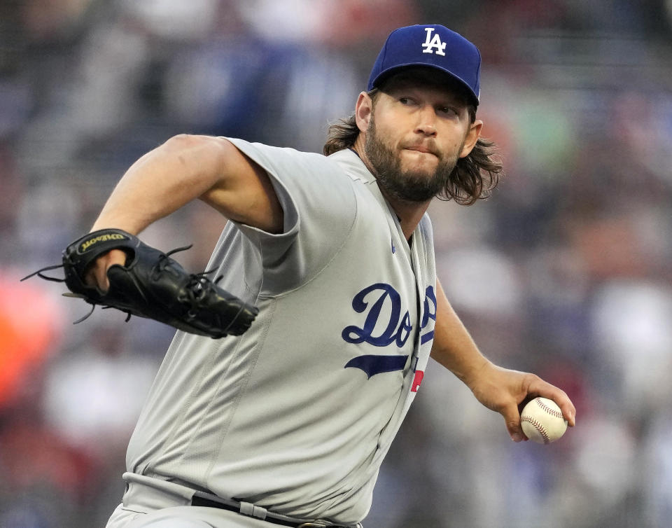 FILE - Los Angeles Dodgers' Clayton Kershaw winds up during a baseball game against the San Francisco Giants in San Francisco, Sept. 30, 2023. Kershaw says he will return for his 17th season with the Dodgers. He says he will be back with the team as part of an agreement that includes a player option for 2025. (AP Photo/Jeff Chiu, File)