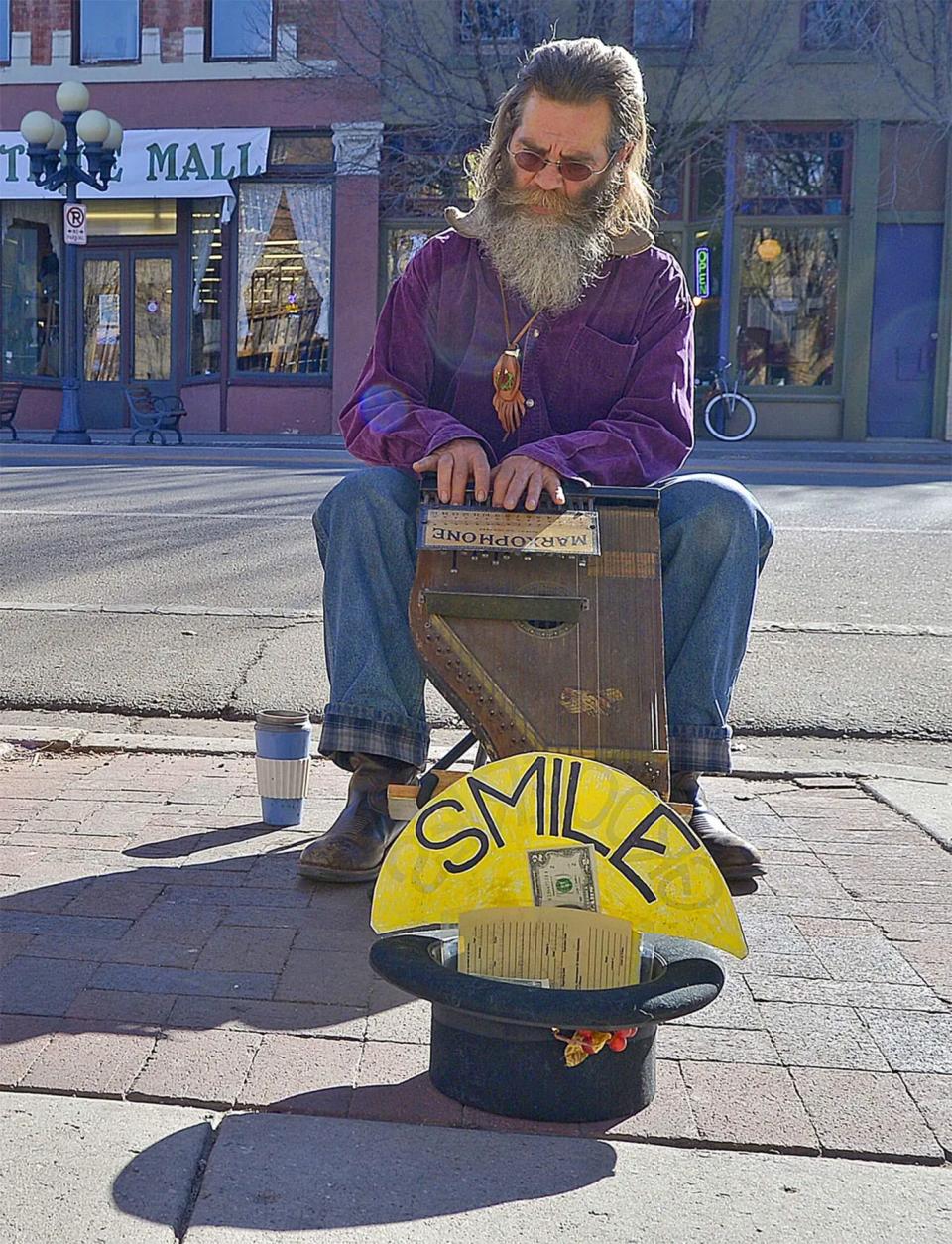Tom Boyd plays his Marxophone on near theintersection of Union and C Street in this 2015 Chieftain photo.