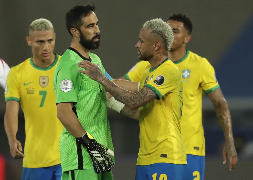 Brazil's Neymar, right, and Chile's goalkeeper Claudio Bravo greet each other at the end of a Copa America quarterfinal soccer match at the Nilton Santos stadium in Rio de Janeiro, Brazil, Friday, July 2, 2021. Chile lost to Brazil 0-1. (AP Photo/Silvia Izquierdo)