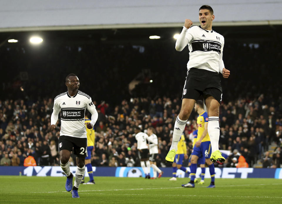 Fulham's Aleksandar Mitrovic, right, celebrates after scoring during a Premier League soccer match between Fulham and Southampton, at Craven Cottage, London, Saturday Nov. 24, 2018. (Steven Paston/PA via AP)