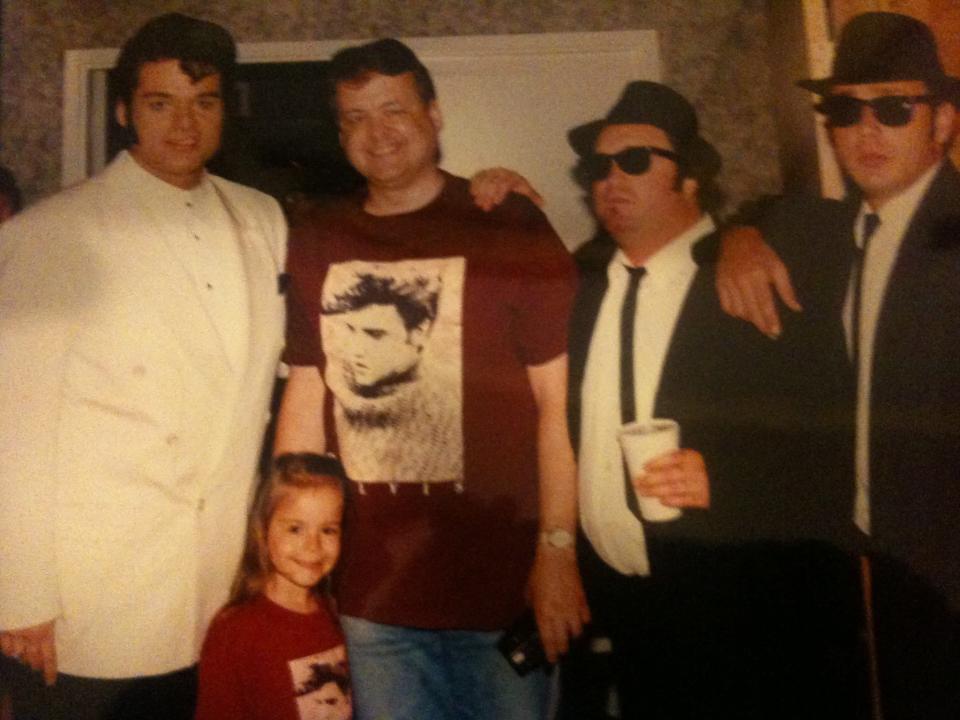 A young Lottie Peterson Johnson stands with her father, Paul Peterson, and Elvis tribute artist James Lowrey at the "Legends in Concert" show in Myrtle Beach, South Carolina.