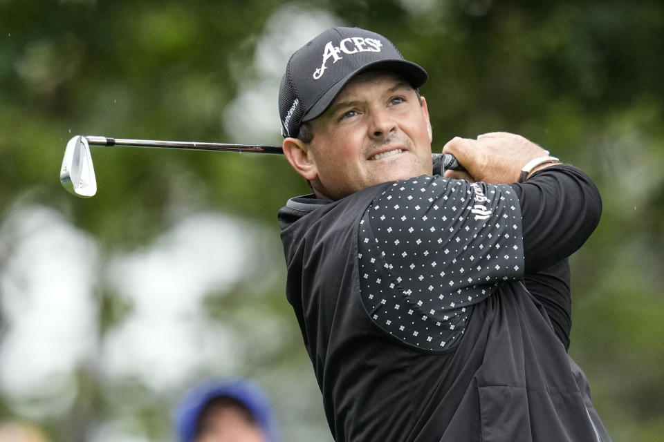 Patrick Reed watches his tee shot on the fourth hole during the weather delayed third round of the Masters golf tournament at Augusta National Golf Club on Saturday, April 8, 2023, in Augusta, Ga. (AP Photo/Mark Baker)