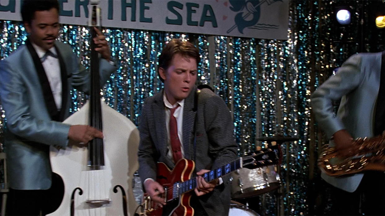  Michael J. Fox as Marty McFly playing Johnny B Goode on the guitar at the Under The Sea dance in Back To The Future. 