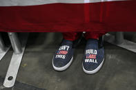 People wait for President Donald Trump to speak at a rally in Estero, Fla., Wednesday, Oct. 31, 2018. (AP Photo/Susan Walsh)