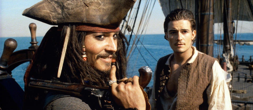 Johnny Depp as Jack Sparrow and Orlando Bloom as Will Turner on a ship in a scene from "Pirates of the Caribbean."