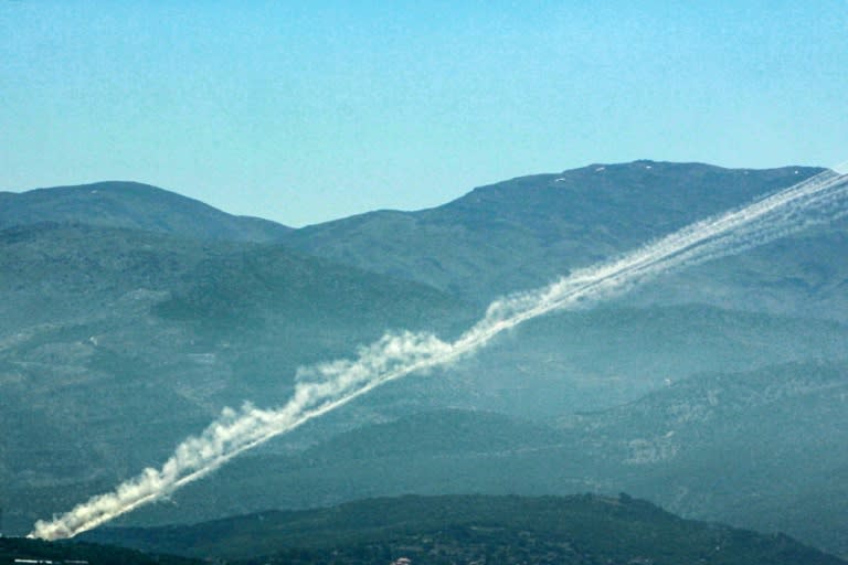 Rockets leave trails of smoke as they are launched from southern Lebanon (-)