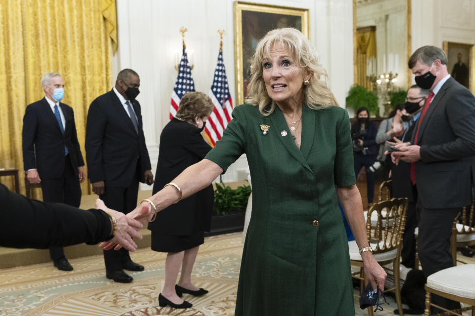 First lady Jill Biden followed by, from left, Veterans Affairs Secretary Denis McDonough, Defense Secretary Lloyd Austin and former Sen. Elizabeth Dole, R-N.C., leaves the East Room following a ceremony at the White House honoring children in military and veteran caregiving families, Wednesday, Nov. 10, 2021. (AP Photo/Manuel Balce Ceneta)