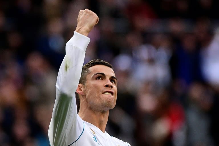 Real Madrid's forward Cristiano Ronaldo celebrates after scoring a penalty on December 9, 2017