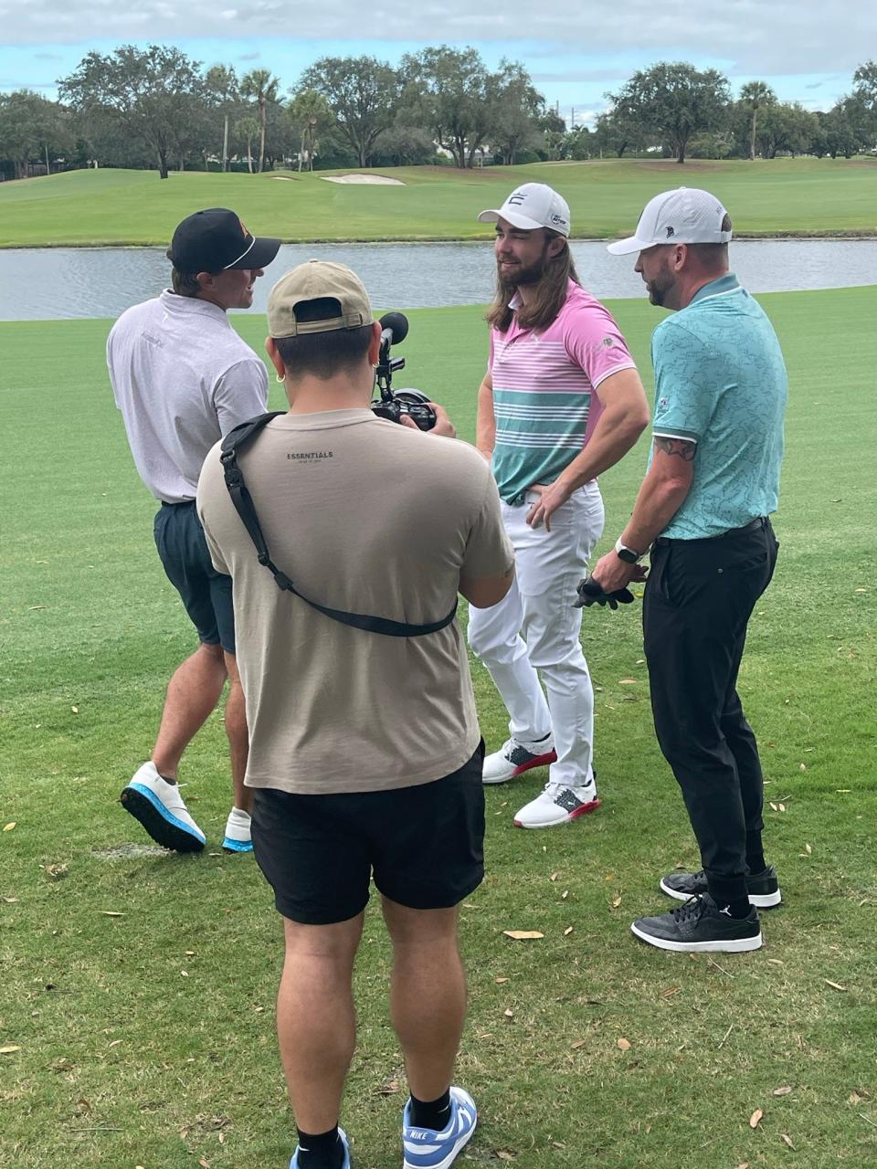 World Long Drive champion Kyle Berkshire (pink shirt) is interviewed at Bear Lakes Country Club while filming his ever-popular “Bombers Club” YouTube podcast.