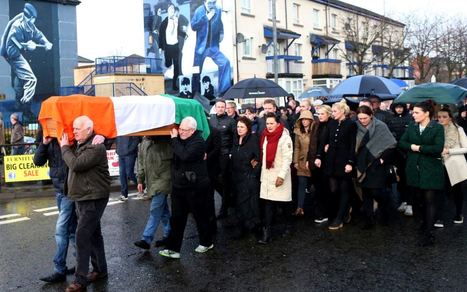 Irish Republicans carry the coffin of Martin McGuinness through the bogside area of Londonderry, Northern Ireland - Credit: Peter Morrison /AP