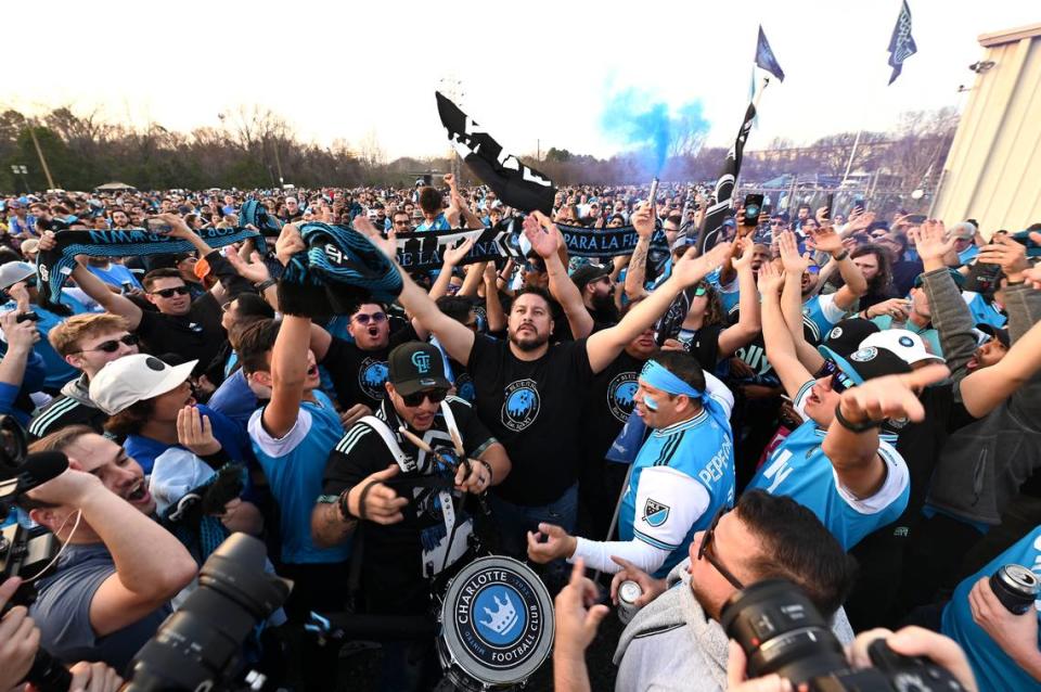 Charlotte Football Club fans sing and chant during a tailgate party in Charlotte, NC on Saturday, March 5, 2022.
