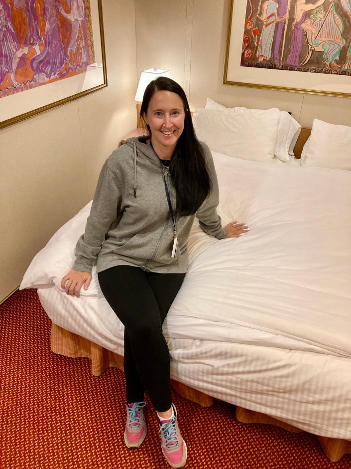 lisa galek is sitting on the bed in the carnival room