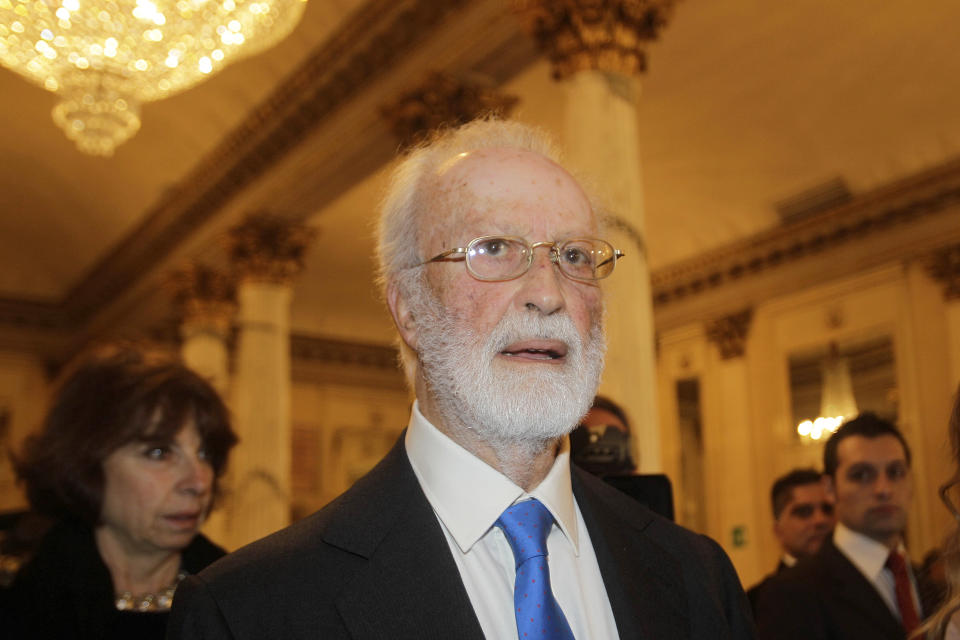 Italian journalist Eugenio Scalfari arrives at the Milan La Scala theater, Italy, Wednesday, Dec. 7, 2011. Eugenio Scalfari, who revolutionized Italian journalism with the creation of La Repubblica, a liberal daily that boldly challenged traditional newspapers, died on Thursday, July 14, 2022, the Senate president announced. He was 98. (AP Photo/Luca Bruno)