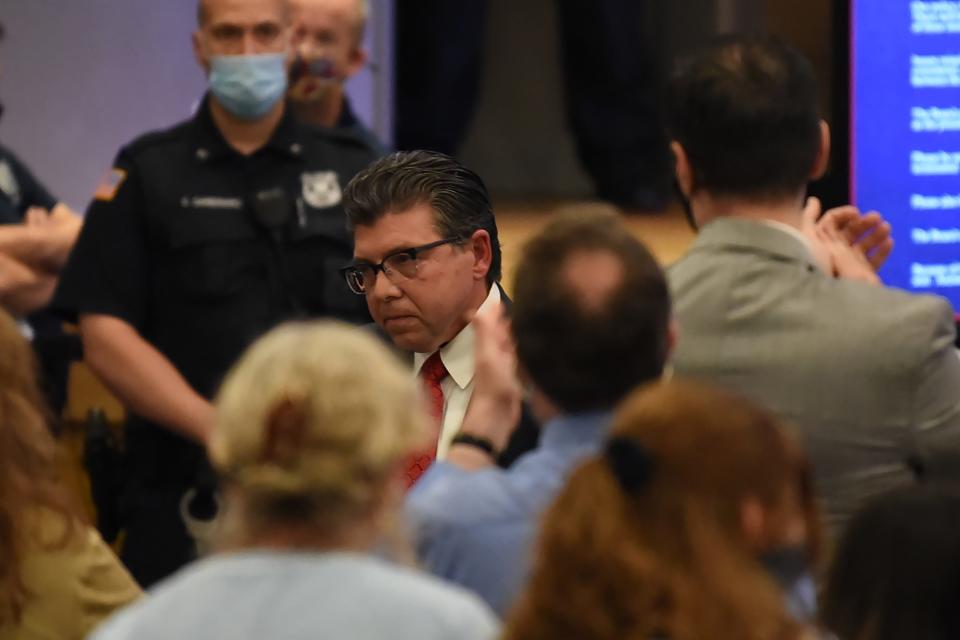 Senator Anthony Bucco walks back to his seat after speaking out on the order to eliminate holiday names on the school calendar during the Board of Education meeting at Randolph Middle School in Randolph on 06/21/21.