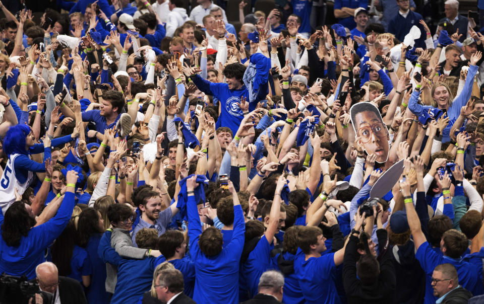 Creighton fans storm the court following the team's 85-66 win over UConn in an NCAA college basketball game Tuesday, Feb. 20, 2024, in Omaha, Neb. (AP Photo/Rebecca S. Gratz)