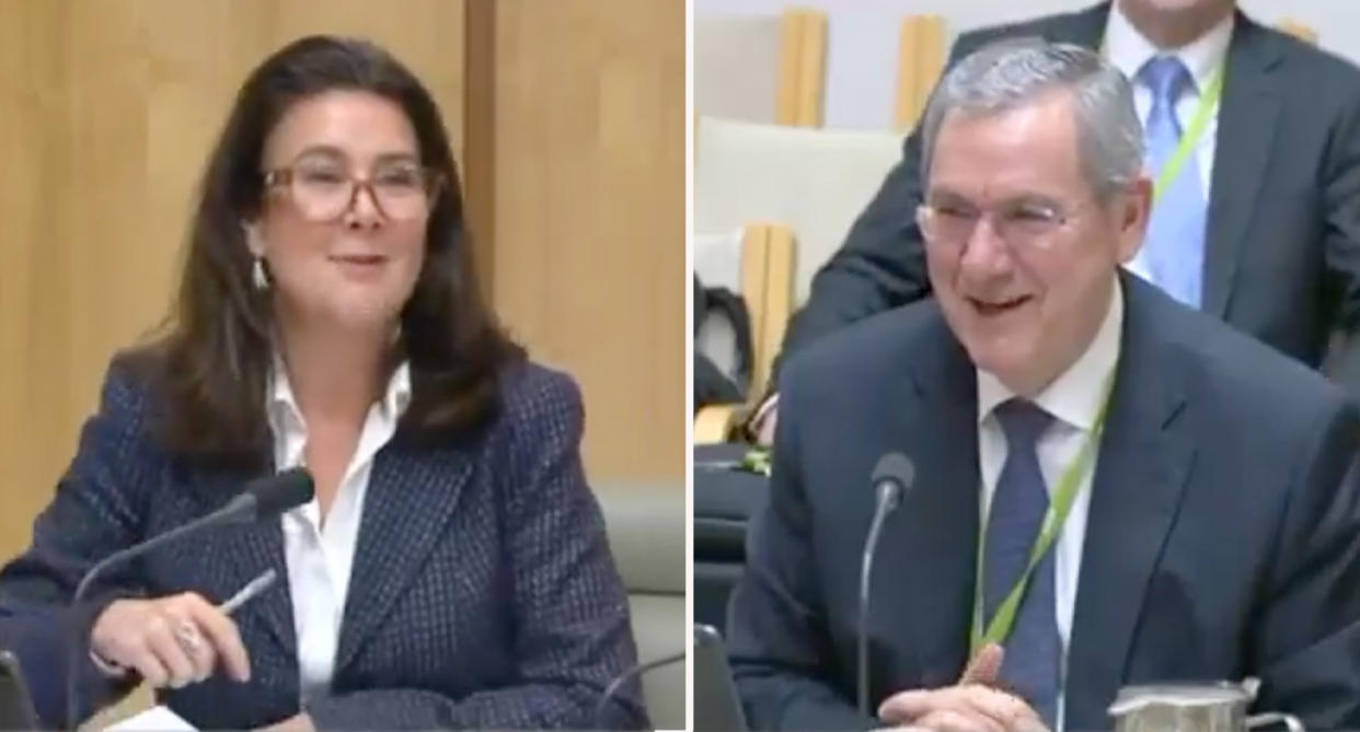 Senator Jane Hume (left) and Joe Longo (right) smiling at each other in parliament. 