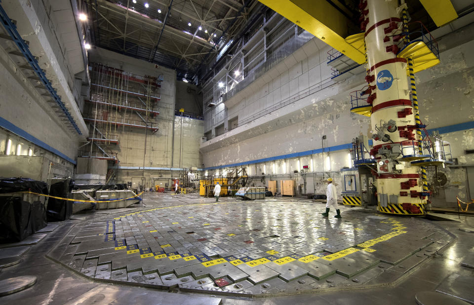 In this photo taken on Tuesday, July 16, 2019, a worker walks on the Reactor 1 of Ignalina Nuclear Power Plant (NPP) in Visaginas some 160km (100 miles) northeast of the capital Vilnius, Lithuania. The HBO TV series “Chernobyl” featuring Soviet era nuclear nightmares is drawing tourists to the atomic filming locations in Lithuania.(AP Photo/Mindaugas Kulbis)