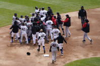 Chicago White Sox and Cleveland Indians benches clear after a pushing incident at second base during the first inning of a baseball game in Chicago, Thursday, April 15, 2021. All are wearing No. 42 in honor of Jackie Robinson Day. (AP Photo/Nam Y. Huh)