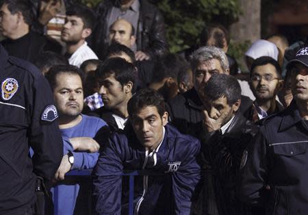 Relatives of miners who are trapped in a coal mine wait in front of a hospital in Soma, a district in Turkey's western province of Manisa May 14, 2014. REUTERS/Osman Orsal