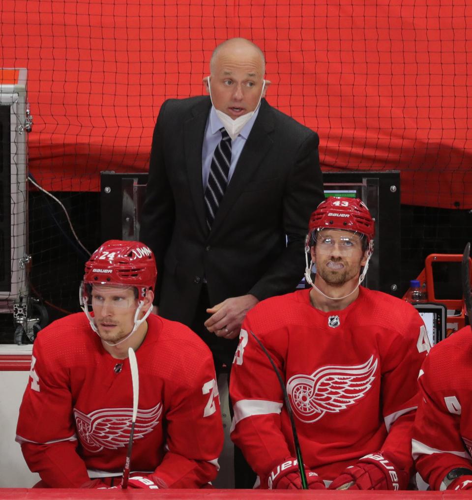Red Wings head coach Jeff Blashill on the bench in the second period on Thursday, April 15, 2021, at Little Caesars Arena.