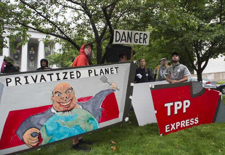 Demonstrators protest against legislation to give US President Barack Obama fast-track authority to advance trade deals, including the Trans-Pacific Partnership (TPP), during a protest march on Capitol Hill in Washington, DC, May 21, 2015