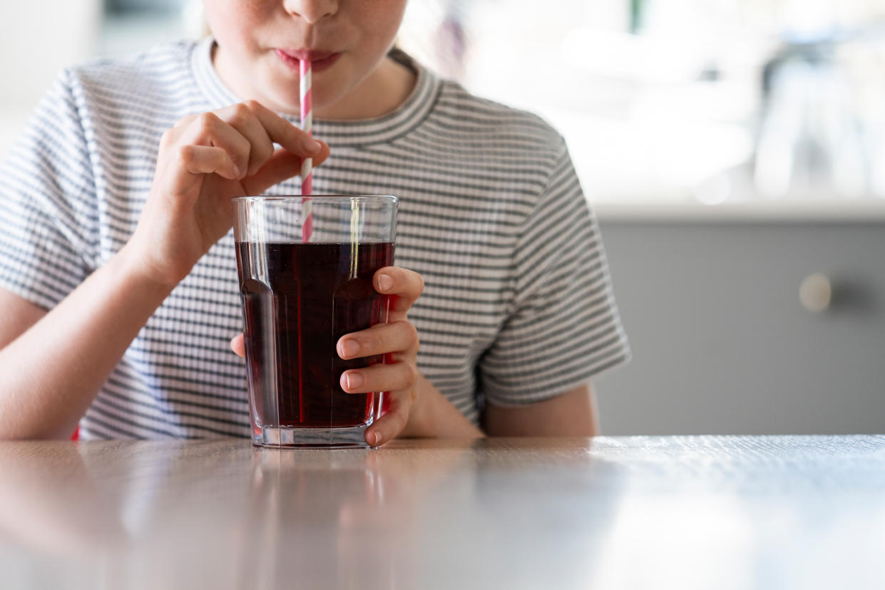 Child drinking fizzy drinks. (Getty Images)