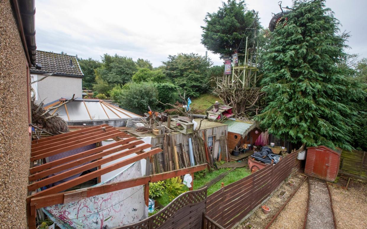 Denis Carbonaro's installation spreads into the back garden to the annoyance of his next door neighbour