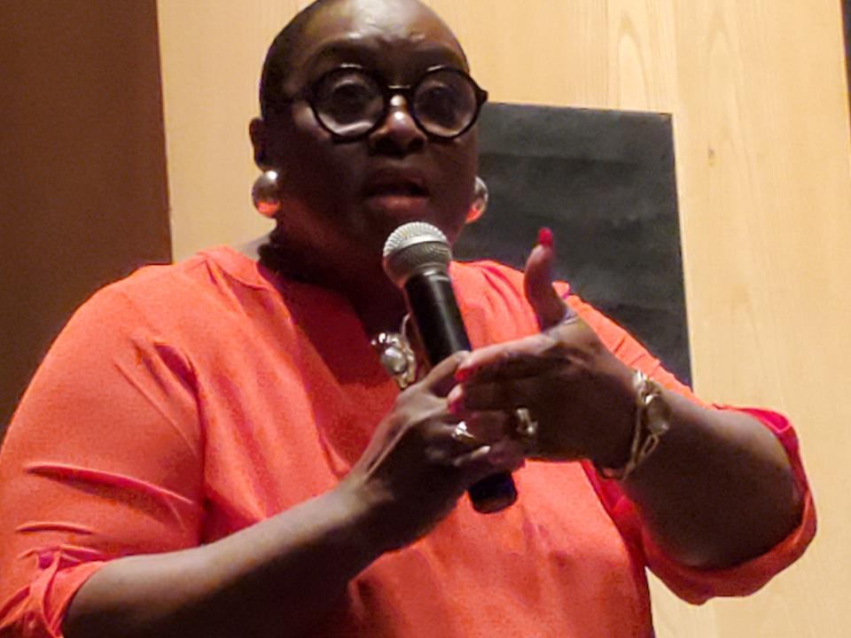 Akron City Council member Linda Omobien (At-Large) addresses a crowd of about 50 at an informational session regarding housing issues Wednesday at the Akron-Summit library's main branch.