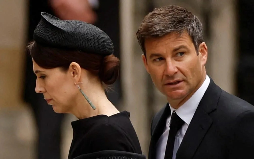 Jacinda Ardern, New Zealand's prime minister, arrives at Westminster Abbey for the late Queen's funeral. She is pictured with her partner, Clarke Gayford - John Sibley/Reuters