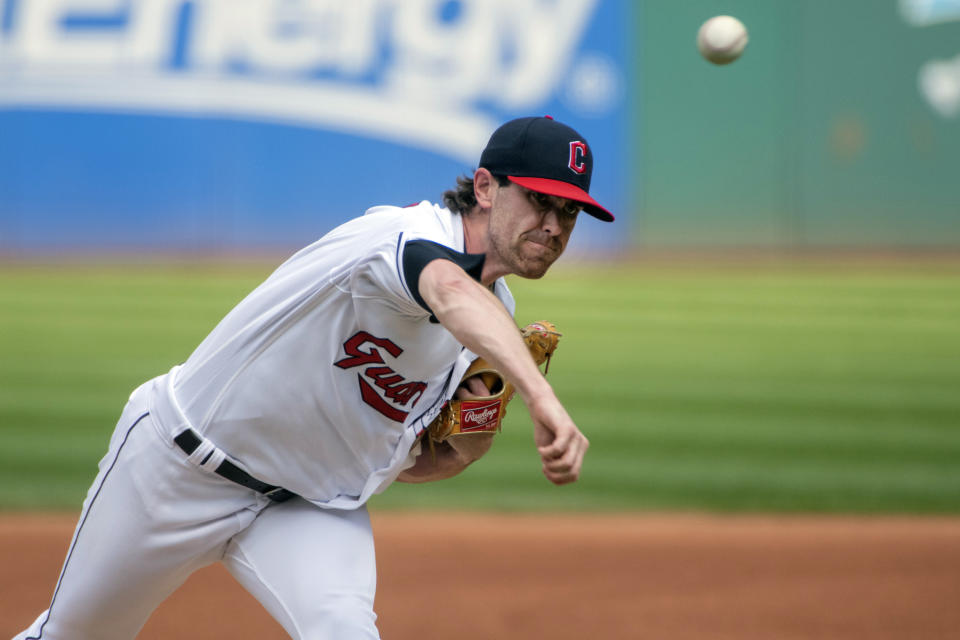 Cleveland Guardians starting pitcher Shane Bieber delivers against the Minnesota Twins during the first inning of the first game of a baseball doubleheader in Cleveland, Saturday, Sept. 17, 2022. (AP Photo/Phil Long)